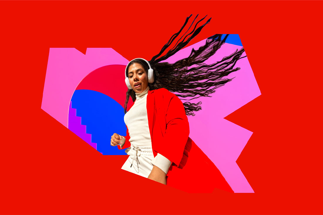 girl with headphones and red backdrop