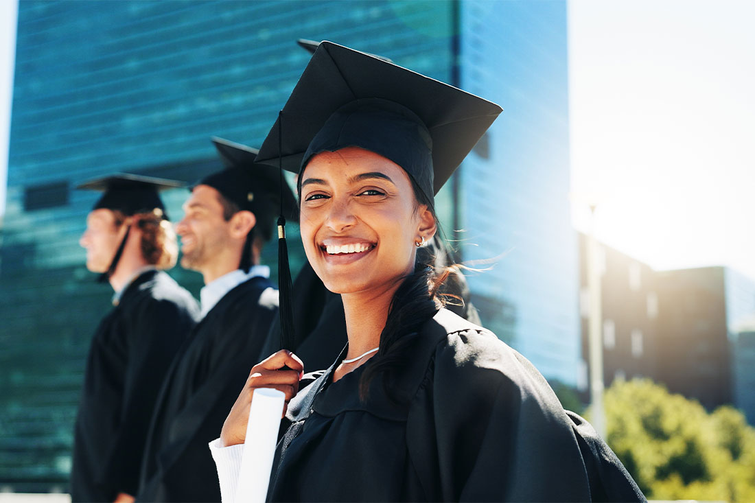 Graduate student smiling with certificate