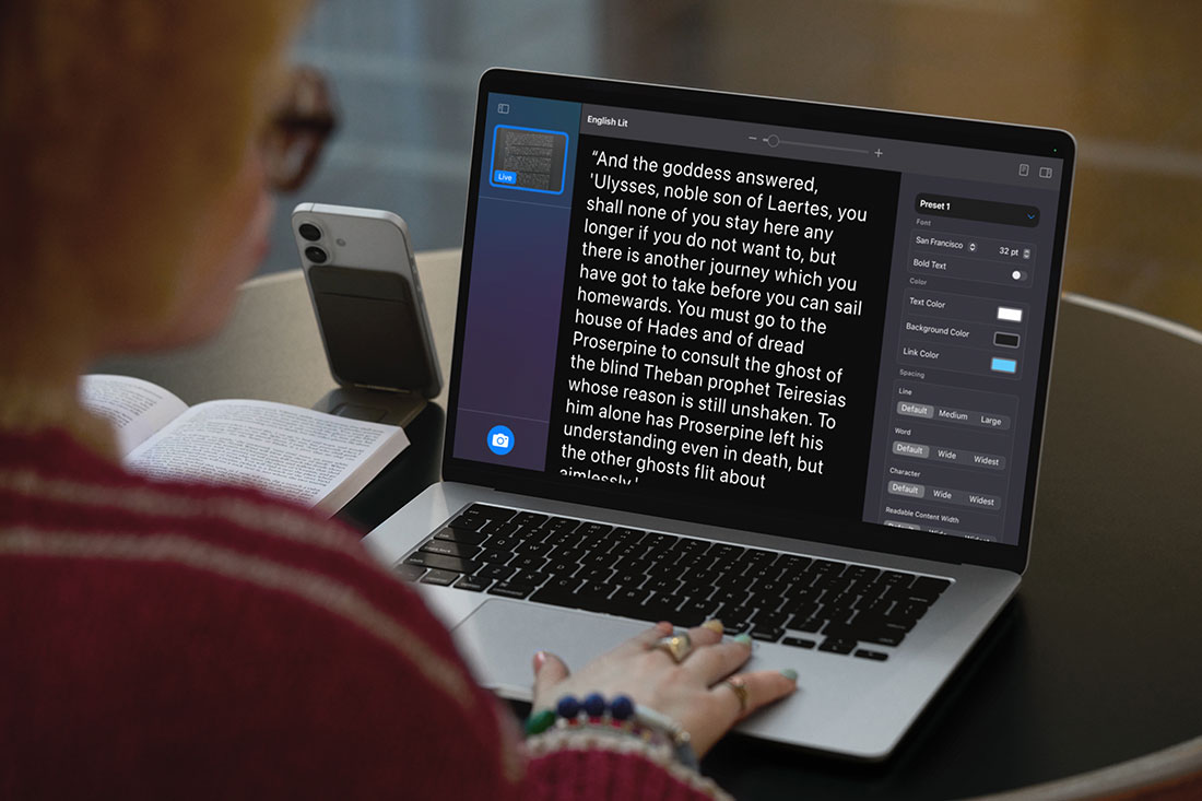 woman on laptop computer with enlarged text accessibility feature