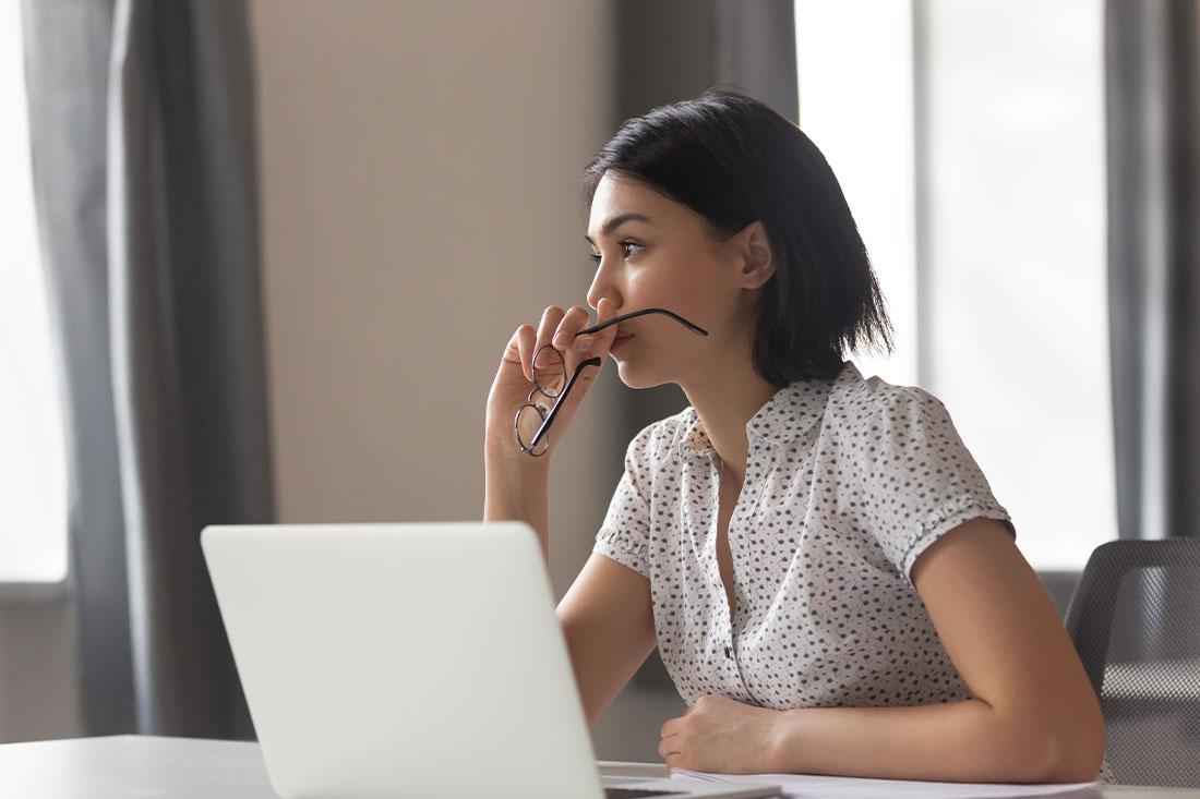 anxious business woman looking away thinking
