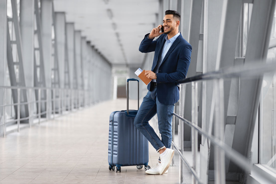 man traveling for business with his favorite accessories