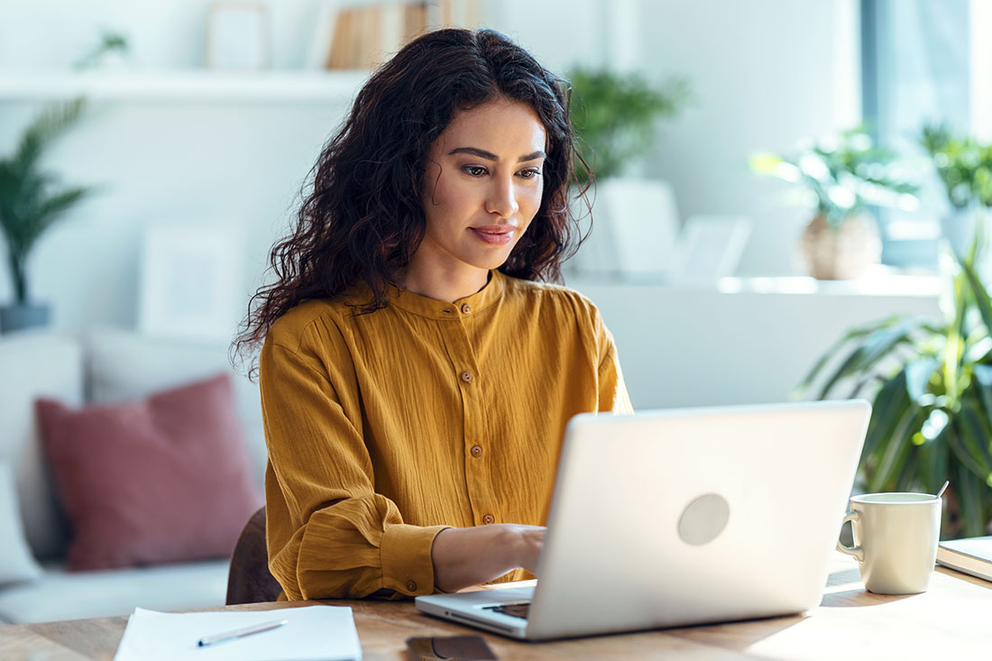 concentrated business woman working with laptop