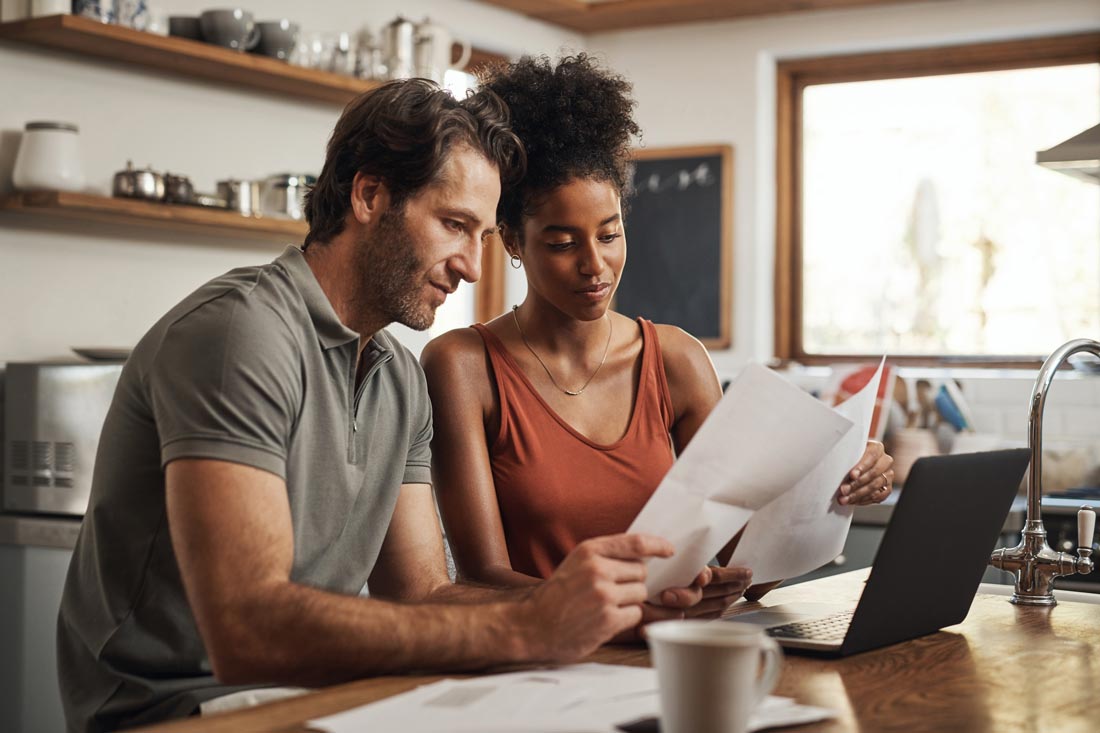 Attractive couple learning how to create a budget together