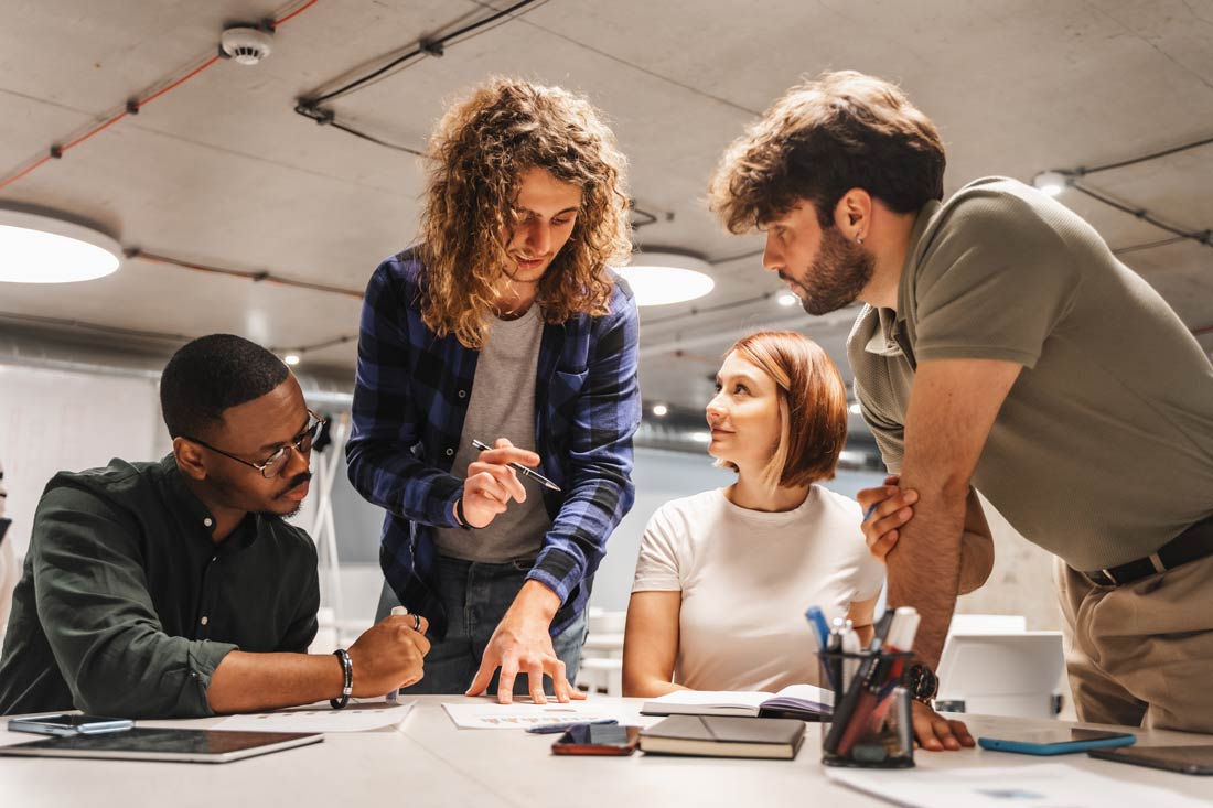 a group of young entrepreneurs learning how to start a new business